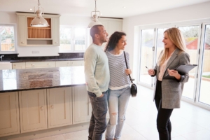 Real estate agent talking to couple